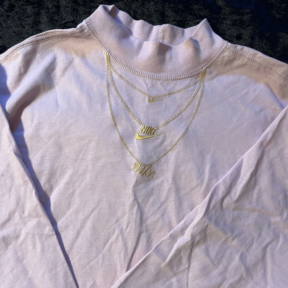 Pink with gold coloring  lose fit Nike tee